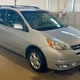 A silver Toyota Sienna minivan